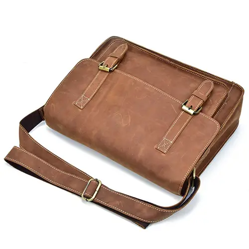 Vintage Leather Messenger Bag with Buckle Straps and Spacious Interior